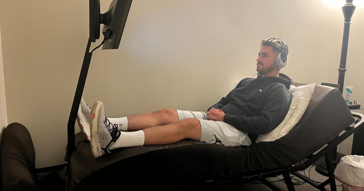 Young man in a neurofeedback session to boost mental and athletic performance at New Beginnings Wellness Center in Smithtown, NY