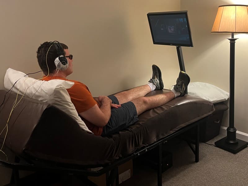 Adult man looking at the screen during a neurofeedback session to help him with ADHD symptoms
